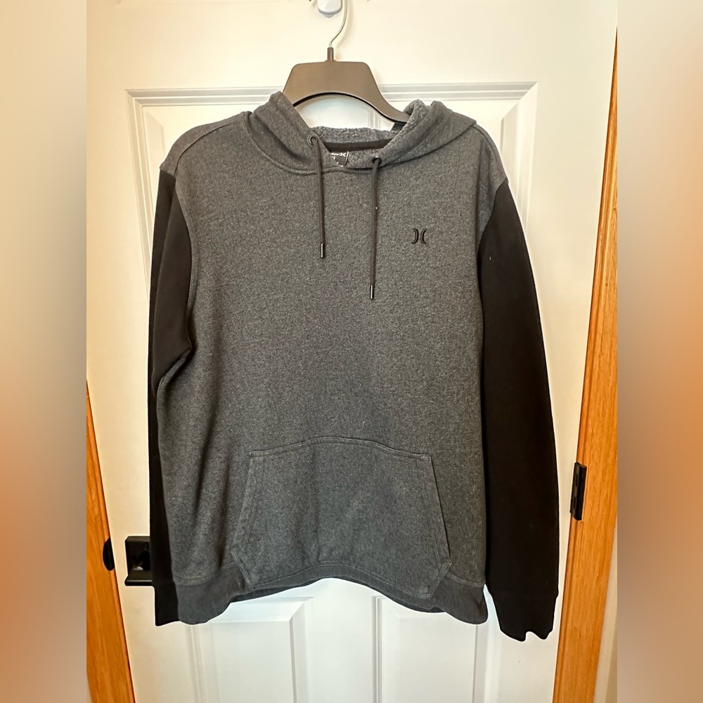Men’s gray and black Hurley pullover hoodie, size Medium.